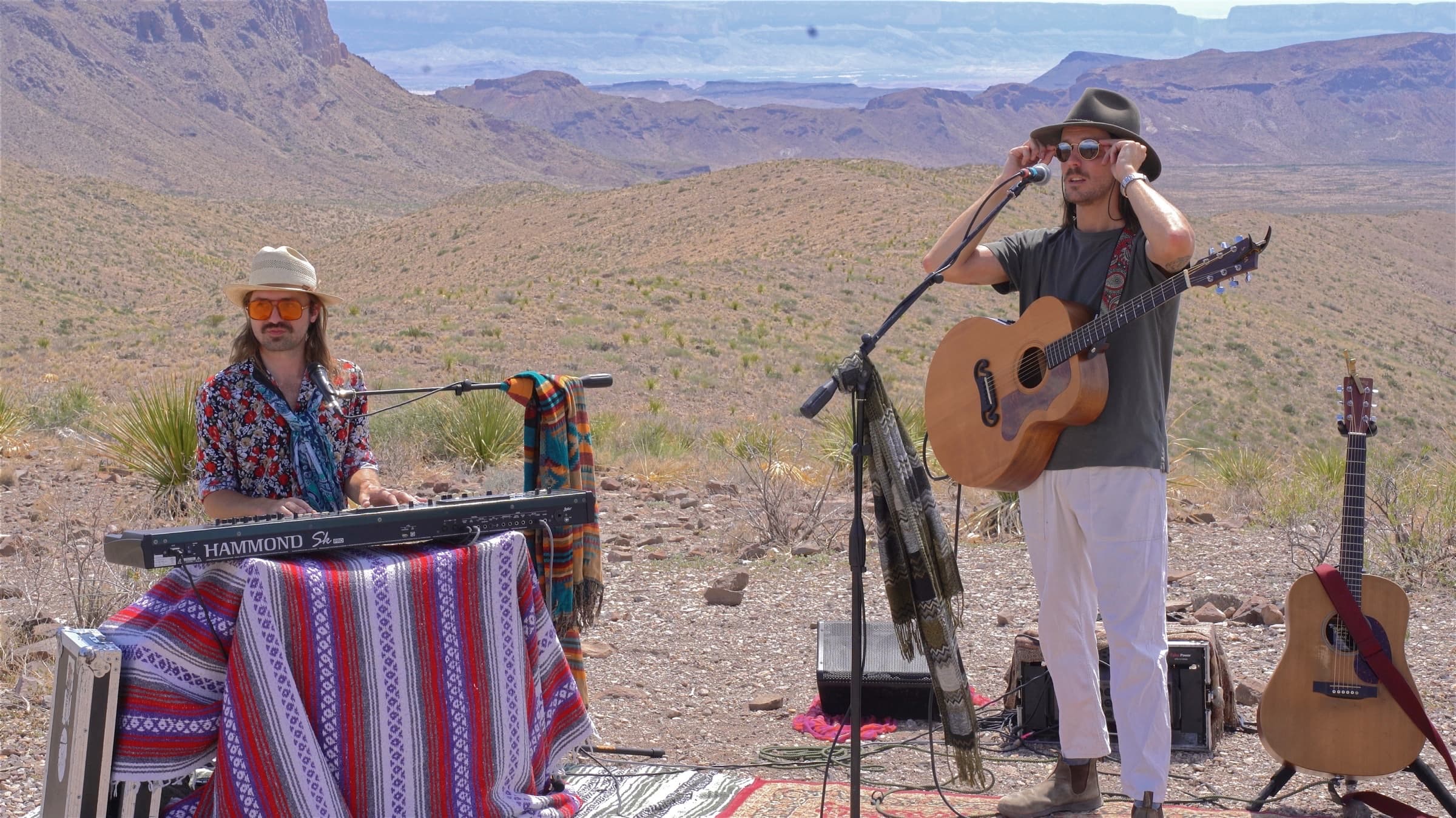 Benjo and Will Patterson performing at a vista in Big Bend National Park